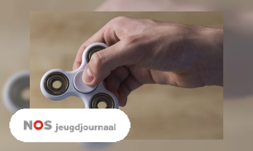 Plaatje Met de handen in het haar om fidget spinners